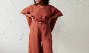 A model in brown linen wide leg trousers